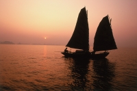 Vietnam, Halong Bay, Fishing junk at dawn - Gareth Jones