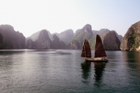Vietnam, Halong Bay, Fishing junk sailing amongst the islands - Gareth Jones