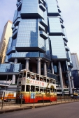 China, Hong Kong, Tram moving past building in Central Hong Kong - Gareth Jones