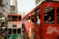 China, Hong Kong, Wanchai, Trams in traffic - Gareth Jones