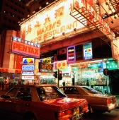 Hong Kong, Causeway Bay, Busy street scene at night. - Gareth Jones