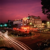 Vietnam, Saigon, Rex Hotel at dusk - Gareth Jones