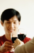 Man drinking wine with friend - Jade Lee