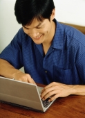 Man using laptop - Jade Lee
