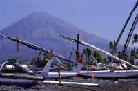 Indonesia, Northern Bali, Amed, Boats in foreground, Mt. Agung in background. - Jill Gocher