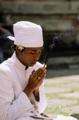 Indonesia, Bali, Hindu priest praying. - Jill Gocher