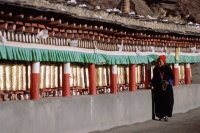 China, Szechuan (Sichuan), Kham region, Tibetan woman making kora ( pilgrimage) at monastery. - Jill Gocher
