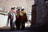 China, Szechuan (Sichuan), Kham region, Khampa men walking through village. - Jill Gocher