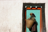 Nepal, Mustang, Woman at painted door - Jill Gocher