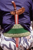 Indonesia, Yogyakarta, Kraton guard in traditional dress with kris - Jill Gocher