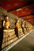 Thailand, Bangkok, Wat Suthat, Row of Buddhas. - James Marshall