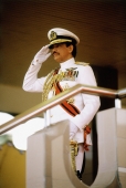 Brunei, Sultan Hassanal Bolkiah saluting during military ceremony in honor of his birthday. - Steve Raymer
