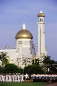 Brunei, Air force airmen march during Sultan Hassanal Bolkiah's birthday celebrations, Omar Ali Saifuddien mosque in background. - Steve Raymer