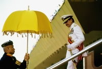 Brunei, Sultan Hassanal Bolkiah descends a reviewing stand after military ceremonies marking his birthday. - Steve Raymer