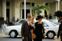 Brunei, A British diplomat and his wife arrive for a birthday celebration honoring Sultan Hassanal Bolkiah of Brunei. - Steve Raymer