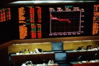 Malaysia, Kuala Lumpur, The Syariah, or Islamic index of the Kuala Lumpur Stock Exchange flashes across the screen. - Steve Raymer