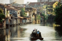 Malaysia, Malacca, a riverboat plies up the Malacca River. - Steve Raymer