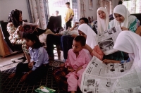 Malaysia, Kota Bharu, a Muslim family passes the Hari Raya Adilfitri holiday. - Steve Raymer