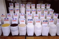 Vietnam, Ho Chi Minh City, rice and other grains for sale. - Steve Raymer