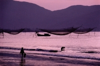 Vietnam, Qui N'hon, South China Sea, fishermen preparing for the day. - Steve Raymer