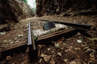 Thailand, Kanchanaburi, Hellfire Pass, A section of train tracks remains in Hellfire Pass as a memorial to those who died there. - Steve Raymer
