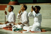 Myanmar (Burma), Yangon (Rangoon), Worshippers praying at the Shwedagon Pagoda - John McDermott