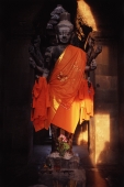 Cambodia, Siem Reap, Statue of Buddha at Angkor - John McDermott
