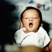 Baby yawning while being held - Erik Soh