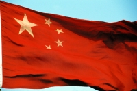 China, Flying China flag. - Jack Hollingsworth