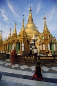 Myanmar (Burma), Yangon (Rangoon), Monks walking around and praying at the Shwedagon Pagoda. - Steve Raymer