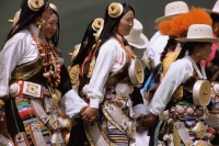 China, Szechuan (Sichuan), Kham region, Nomad women dancing in traditional clothes. - Jill Gocher