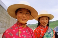 China, Szechuan (Sichuan), Kham region, Khampa women in traditional dress and hats. - Jill Gocher