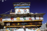 China, Szechuan (Sichuan), Kham region, Tibetan Buddhist Chorten decorated with Buddhist symbols. - Jill Gocher