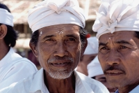 Indonesia, Bali, Hindu priests with rice markings on their foreheads at festival. - Jill Gocher