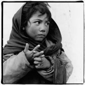 India, Ladakh, Leh, Young boy looking away. - Mary Grace Long
