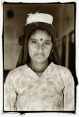 India, near Dharamsala, Dolma Ling Nunnery, Portrait of Indian lady working at nunnery. - Mary Grace Long