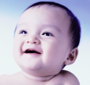 Baby girl, 6 months old, smiling. - Erik Soh