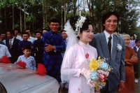 Vietnam, Tay Ninh, Wedding couple with families and friends. (grainy) - Martin Westlake