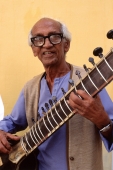 India, Karnataka, Mysore, Hotel sitar player. (grainy) - Martin Westlake