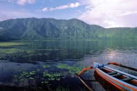 Indonesia, Bali, Lake Bratan, crater lake with fishing boat in foreground. (grainy) - Martin Westlake