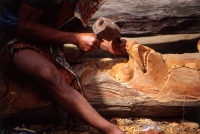 Indonesia, Bali, Ubud, Woodcarver carving from tree trunk. (grainy) - Martin Westlake