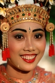 Indonesia, Bali, Ubud, Portrait of Legong dancer in headdress, smiling. (grainy) - Martin Westlake