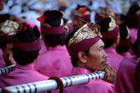 Indonesia, Bali, Besakih Temple, Gamelan players carrying gongs arrive at temple. (grainy) - Martin Westlake