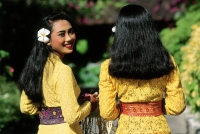 Indonesia, Bali, Kuta, Girls in Balinese ceremonial dress.  (grainy) - Martin Westlake