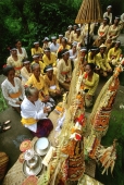 Indonesia, Bali, Gianyar, Pengastian ceremony, priestess leads prayers at holy water collection place. (grainy) - Martin Westlake