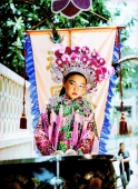 China, Hong Kong, Cheung Chau Island, Portrait of girl, 9, standing on a float, wearing a traditional costume during the Bun Festival procession in 2000 - Carsten Schael