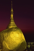 Myanmar (Burma), Kyaiktiyo, Worshippers at 'golden rock' at sunset. - Martin Westlake
