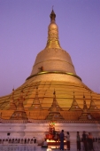 Myanmar (Burma), Bago, Worshippers at Shwemawdaw Paya at dusk. - Martin Westlake