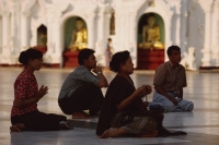Myanmar (Burma), Yangon, Worshippers praying at Shwedagon Paya. - Martin Westlake