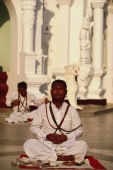 Myanmar (Burma), Yangon, Ascetic man stares into sun whilst meditating at Shwedagon Paya. - Martin Westlake